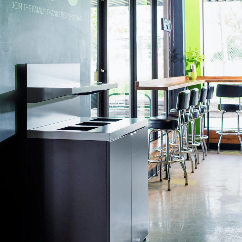 triple station for collecting waste recycling and organics including a shelf for collecting trays in a restaurant