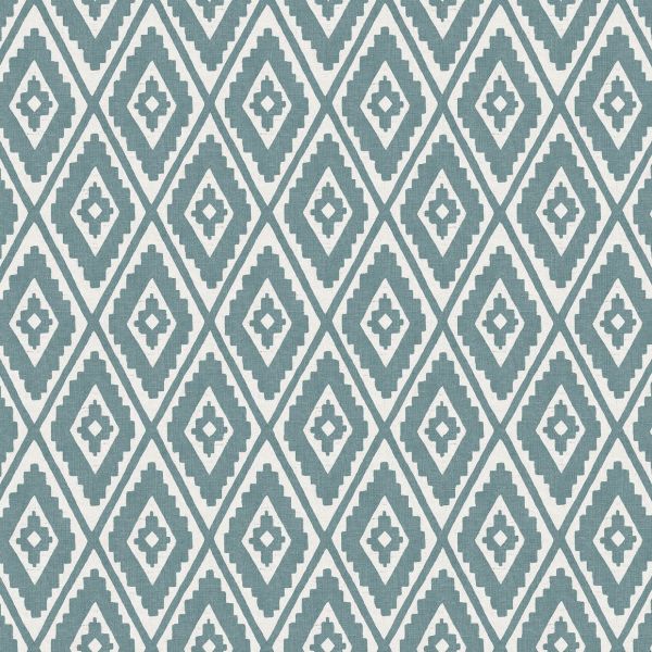 Geometric fabric or wallpaper with teal, stepped diamond motifs arranged in a regular repeating lattice, covering the surface; functioning as decorative wall or upholstery covering in a well-lit interior.