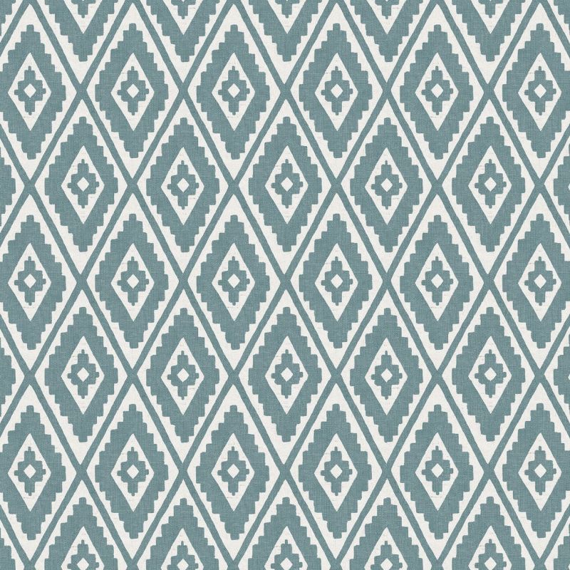 Geometric fabric or wallpaper with teal, stepped diamond motifs arranged in a regular repeating lattice, covering the surface; functioning as decorative wall or upholstery covering in a well-lit interior.