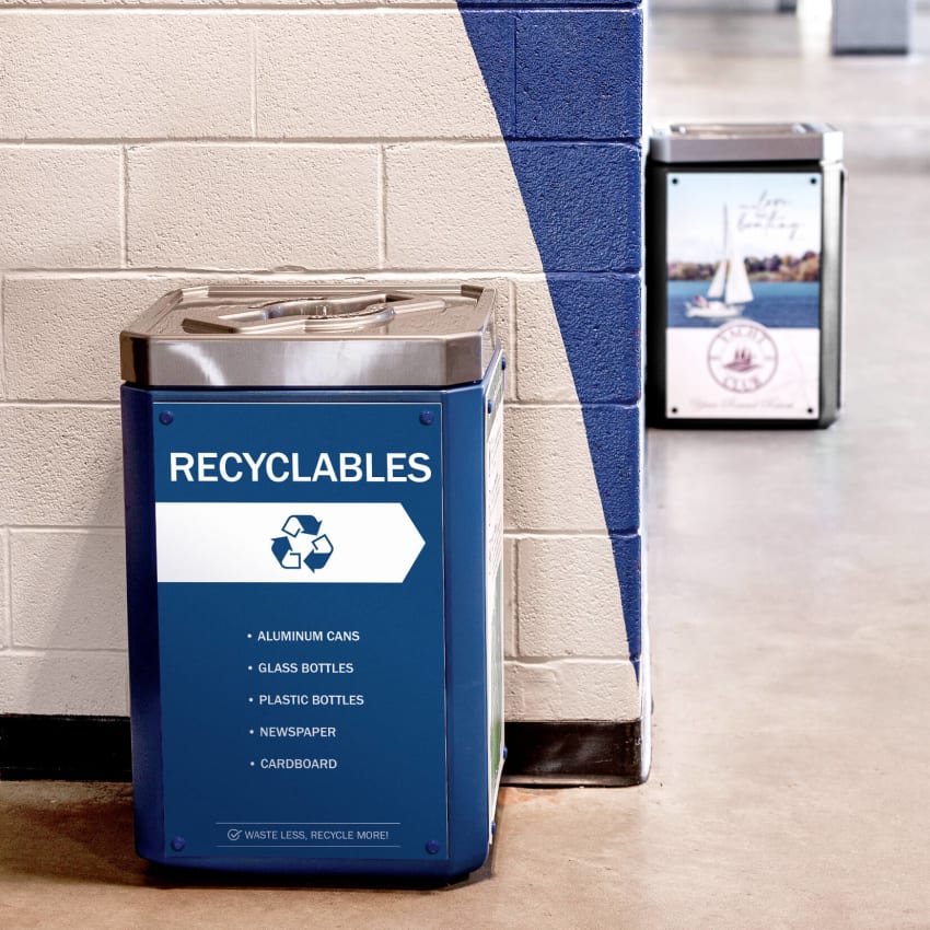 blue recycling container with mixed opening lid including a large body sign in an arena hallway