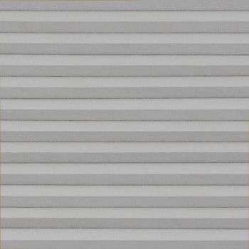 Horizontal pleated cellular blinds, fully lowered across the frame, their alternating light-and-dark gray folds closed, blocking view and softly diffusing daylight in a neutral, evenly lit interior.