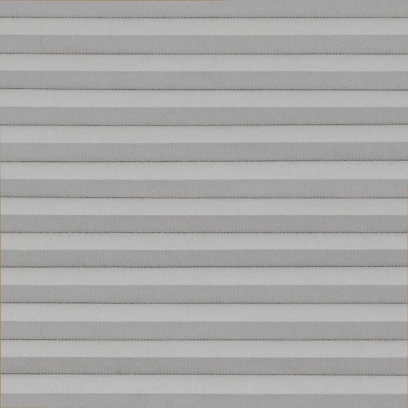 Horizontal pleated cellular blinds, fully lowered across the frame, their alternating light-and-dark gray folds closed, blocking view and softly diffusing daylight in a neutral, evenly lit interior.