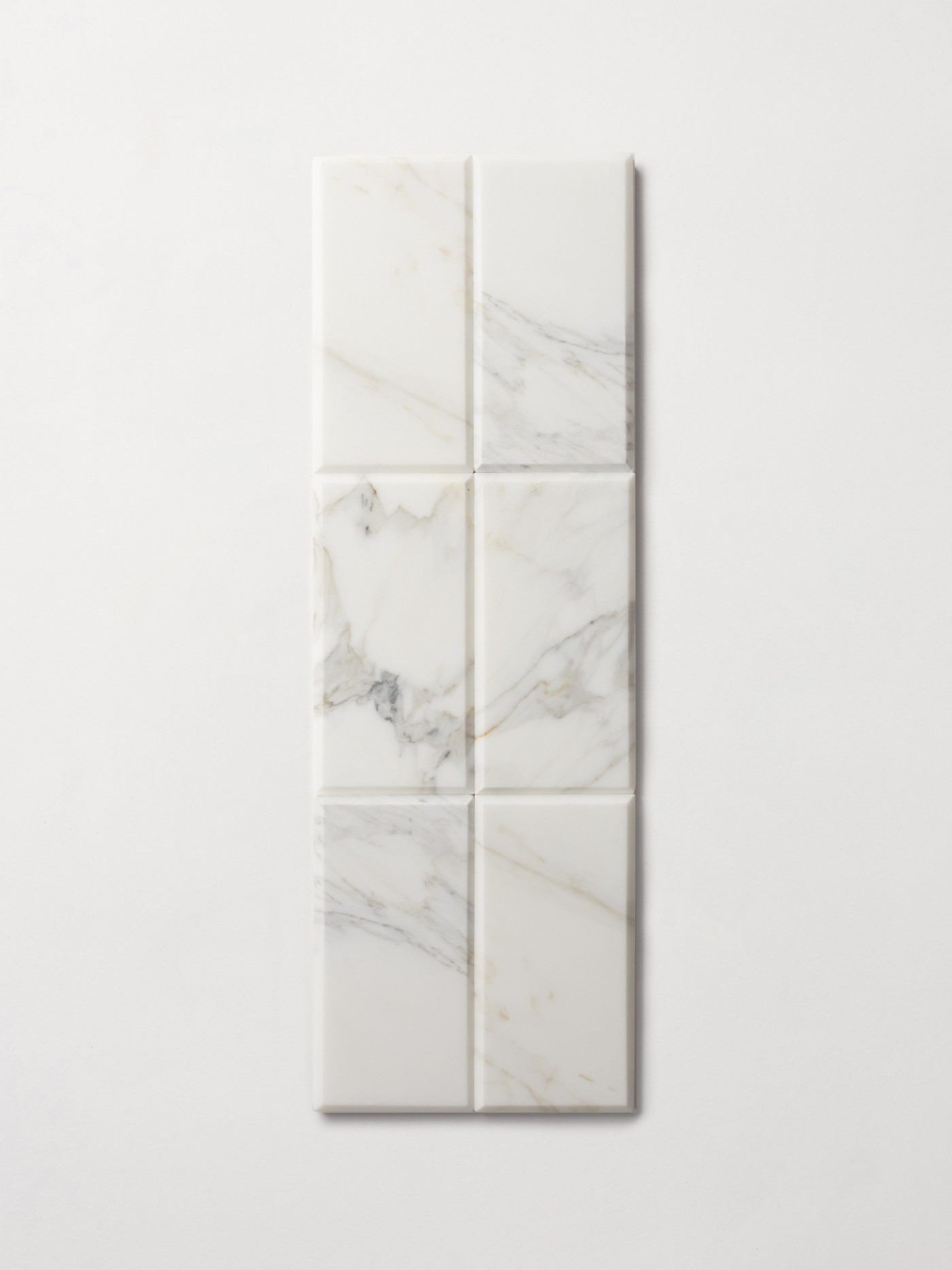 a set of white marble rectangle tiles on a white background.