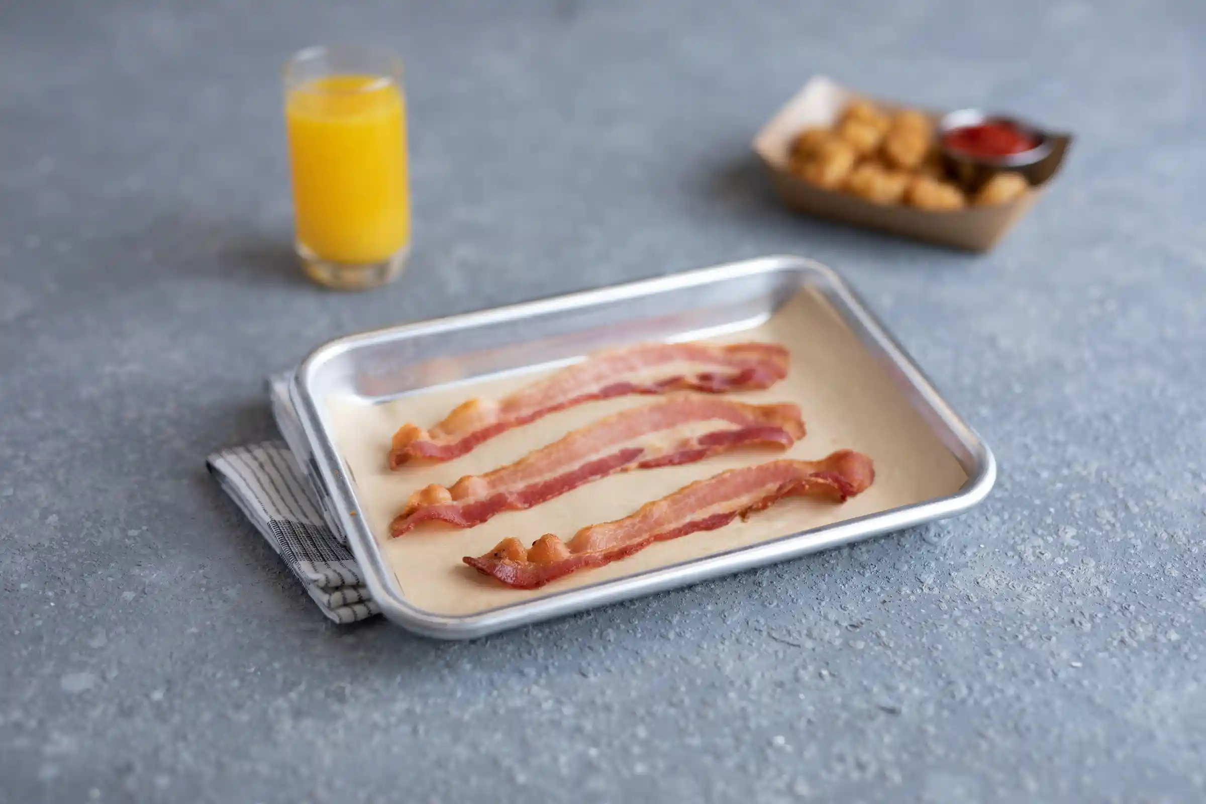 Wright® Brand Naturally Hickory Smoked Thin Sliced Flat-Pack® Bacon, 15 Lbs, 18-22 Slices per Pound, Frozen https://images.salsify.com/image/upload/s--h3u2dwmZ--/q_25/hox5m5ow5iellqrxwwnd.webp
