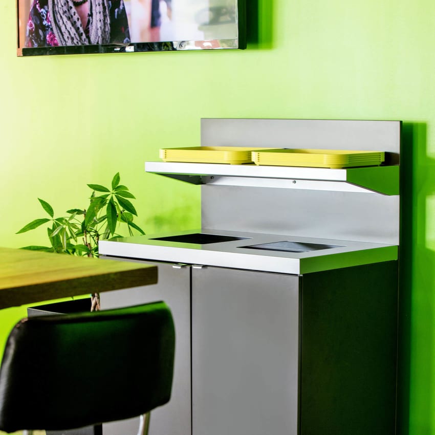 indoor recycling collection container with a shelf for collecting food trays in a restaurant setting