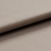 Beige tightly woven upholstery fabric, folded with an overlapping edge across the frame, revealing a pebble-like weave; close-up macro view with soft neutral lighting and plain background.