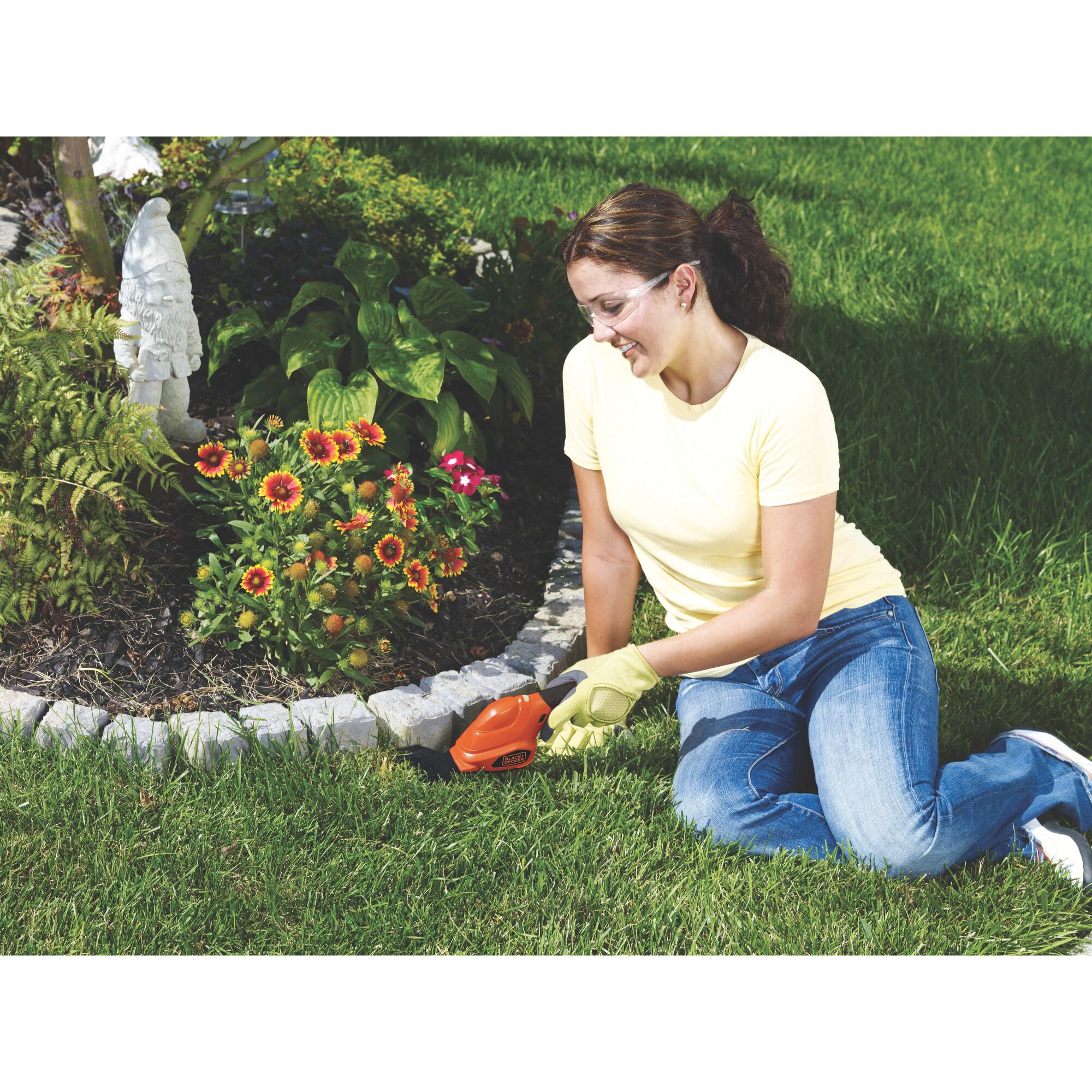 Lithium 2 in 1 Garden Shear Shrubber Combo being used by a person in a garden.