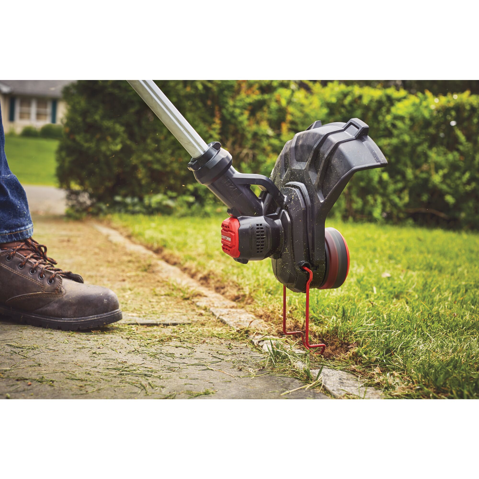 Ergonomic telescoping pole feature of 20 volt weedwacker 13 inch cordless string trimmer and edger with automatic feed kit.