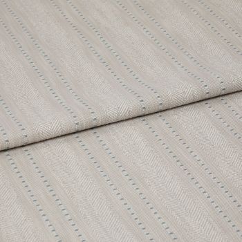 Beige woven fabric featuring herringbone chevrons and thin blue dotted vertical stripes â€” folded over itself, displayed as a close-up textile sample on a neutral, softly lit surface.