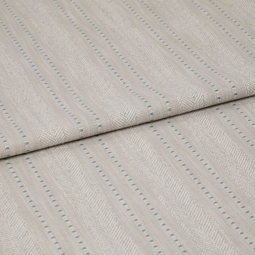 Beige woven fabric featuring herringbone chevrons and thin blue dotted vertical stripes â€” folded over itself, displayed as a close-up textile sample on a neutral, softly lit surface.