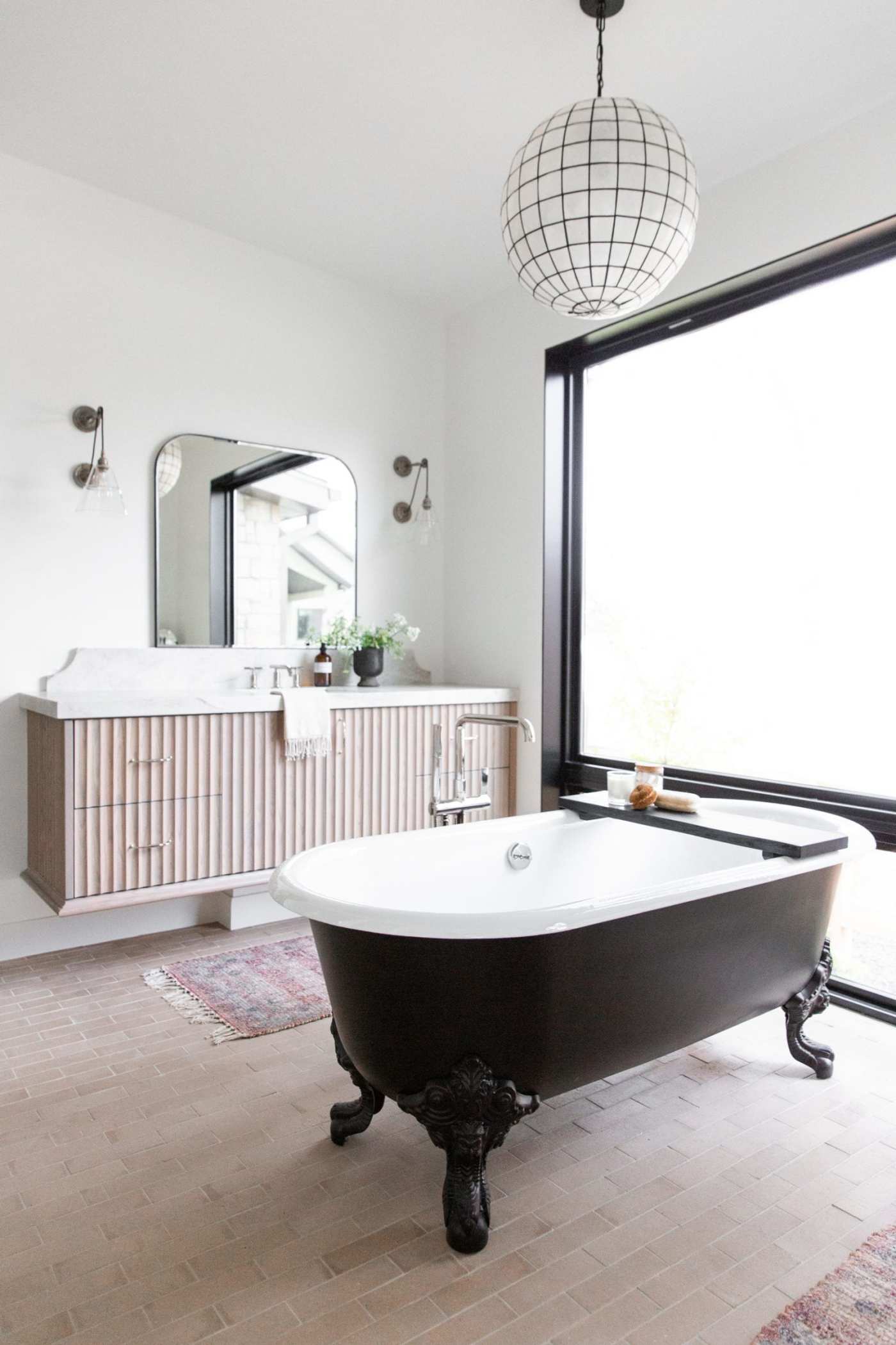 a bathroom with a black and white tub.