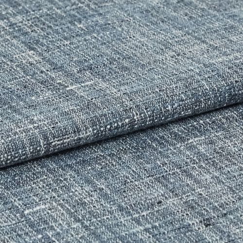 Blue-gray woven fabric swatch with irregular white flecks â€” folded and overlapped â€” close-up studio view with even lighting, emphasizing coarse looped weave and subtle color variation.