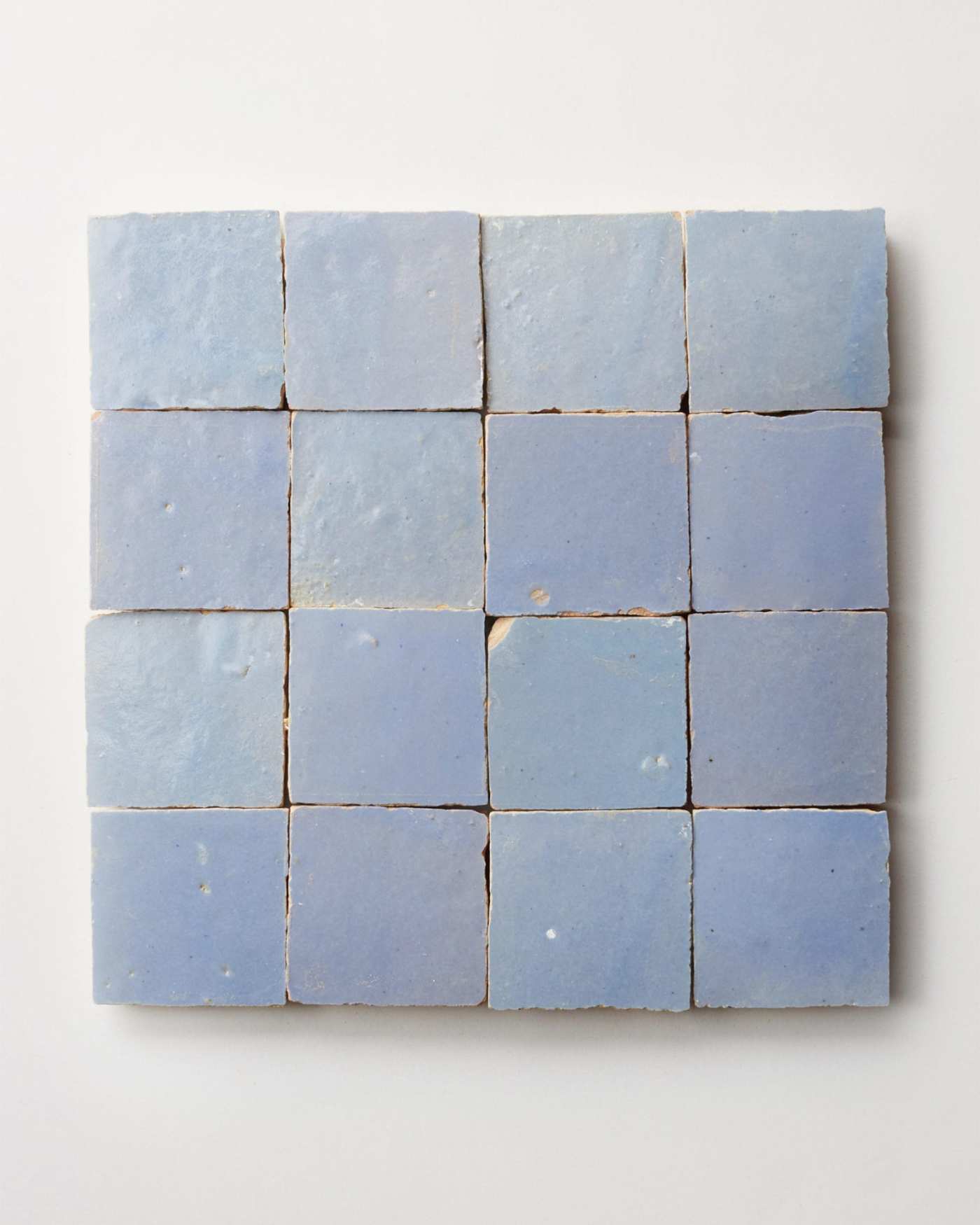 square blue tiles on a white surface.