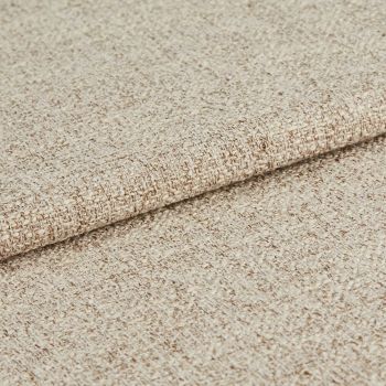 Beige woven upholstery fabric, densely textured and folded once; showing looped weave and subtle two-tone yarns, close-up on a neutral background under soft, even lighting.