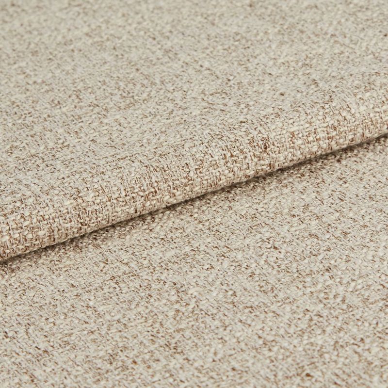 Beige woven upholstery fabric, densely textured and folded once; showing looped weave and subtle two-tone yarns, close-up on a neutral background under soft, even lighting.