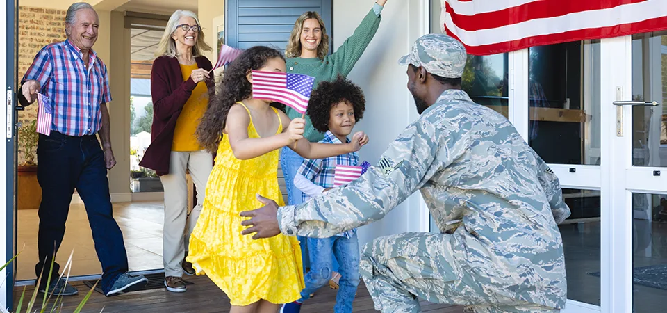 Excited family welcoming solider home