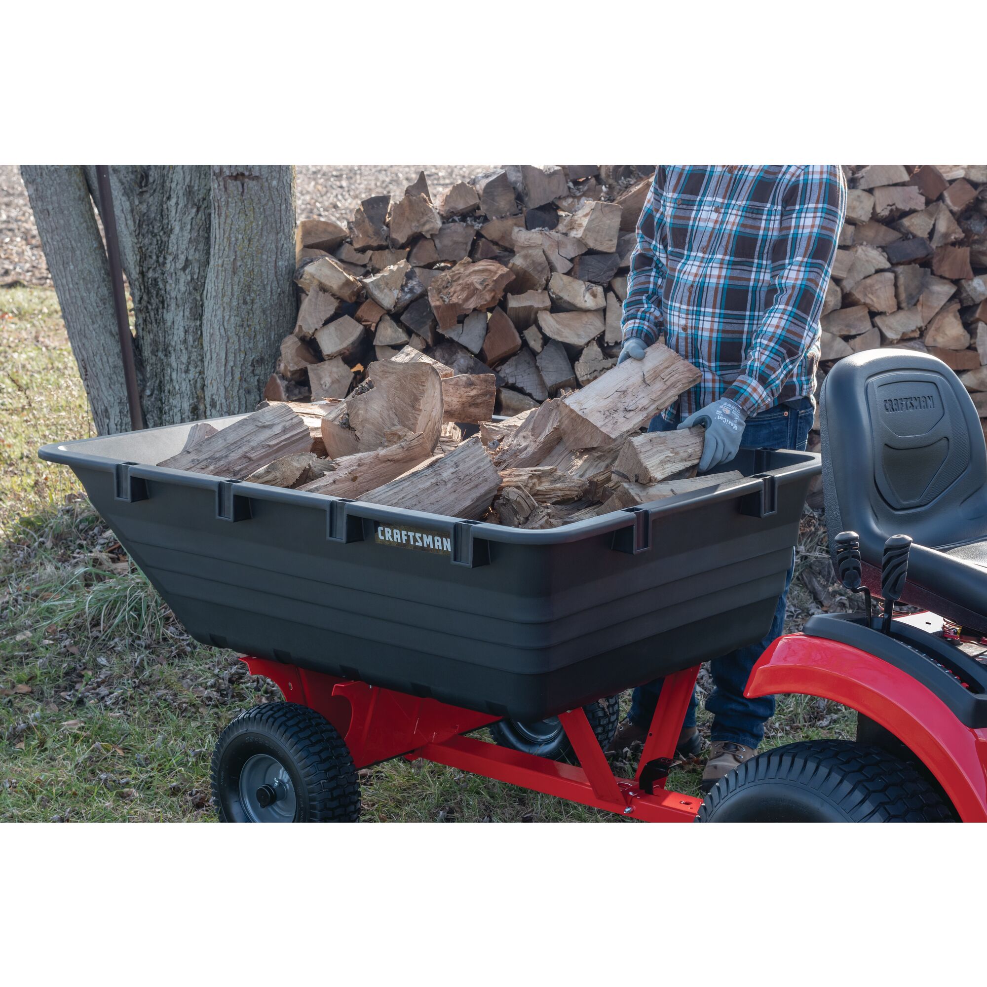 17 cubic foot poly cart being used to carry wood.