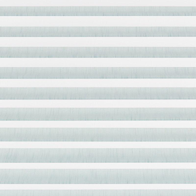 Horizontal zebra blinds spanning the frame, alternating opaque white and pale blue translucent fabric; aligned in closed bands, filtering and diffusing daylight across a minimal, evenly lit interior.