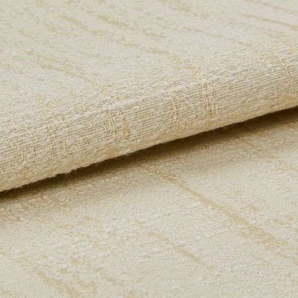 Beige woven fabric with a subtle raised grid and slight sheen, folded and layered across the frame, shown in a close-up, softly lit studio view emphasizing texture and threads.