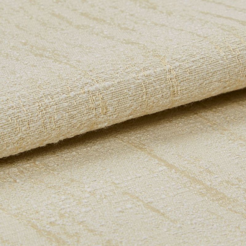 Beige woven fabric with a subtle raised grid and slight sheen, folded and layered across the frame, shown in a close-up, softly lit studio view emphasizing texture and threads.