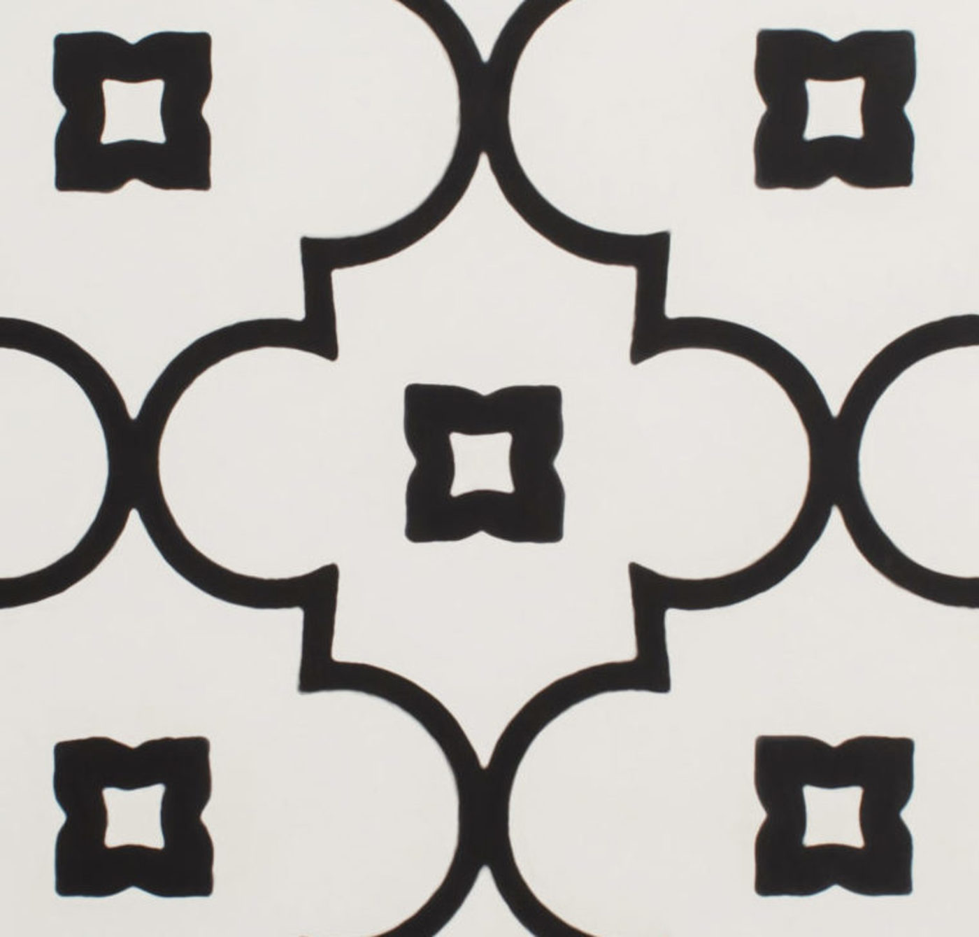 a tile with black and white designs on it.