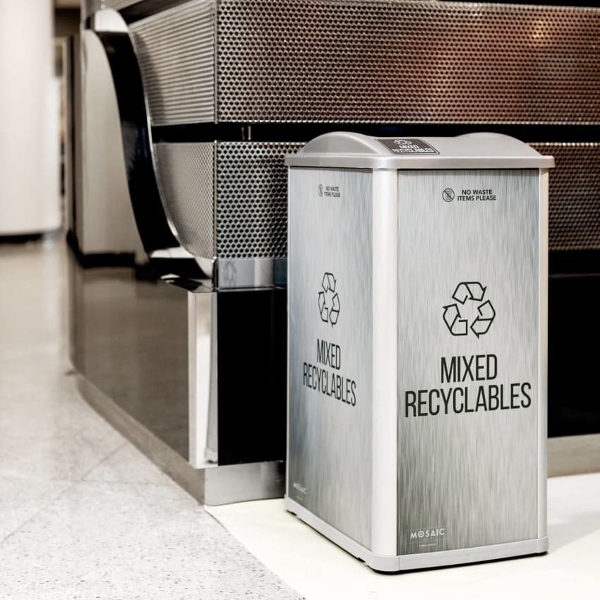 mixed recyclables container in an automotive showroom with signage