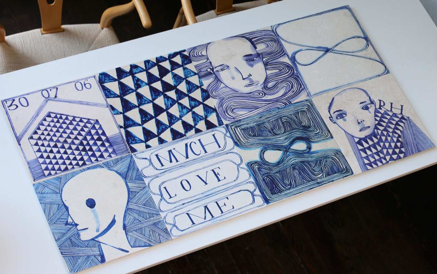 a white table with blue and white tiles on it.