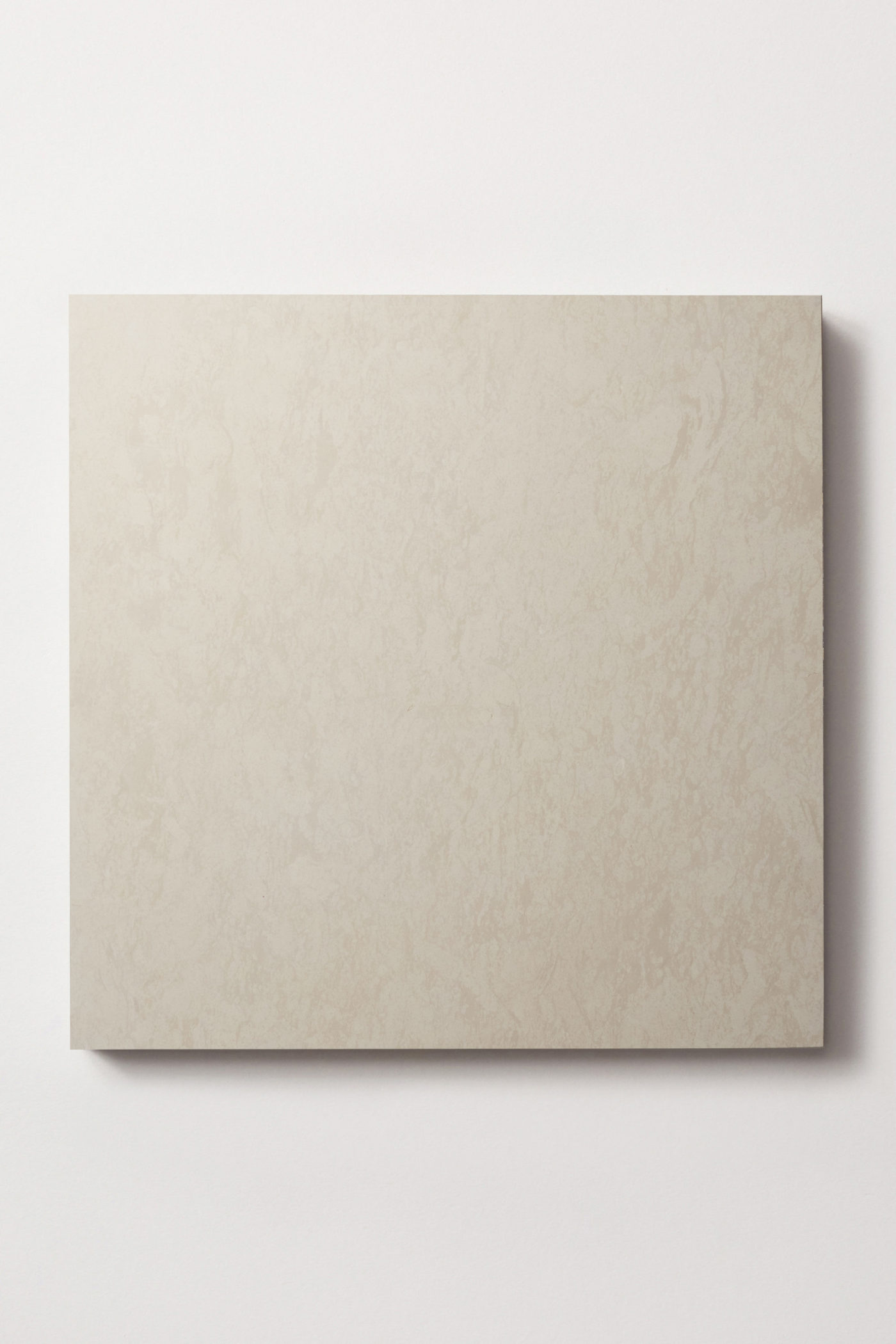 A single square limestone tile in beige centered on a white background.