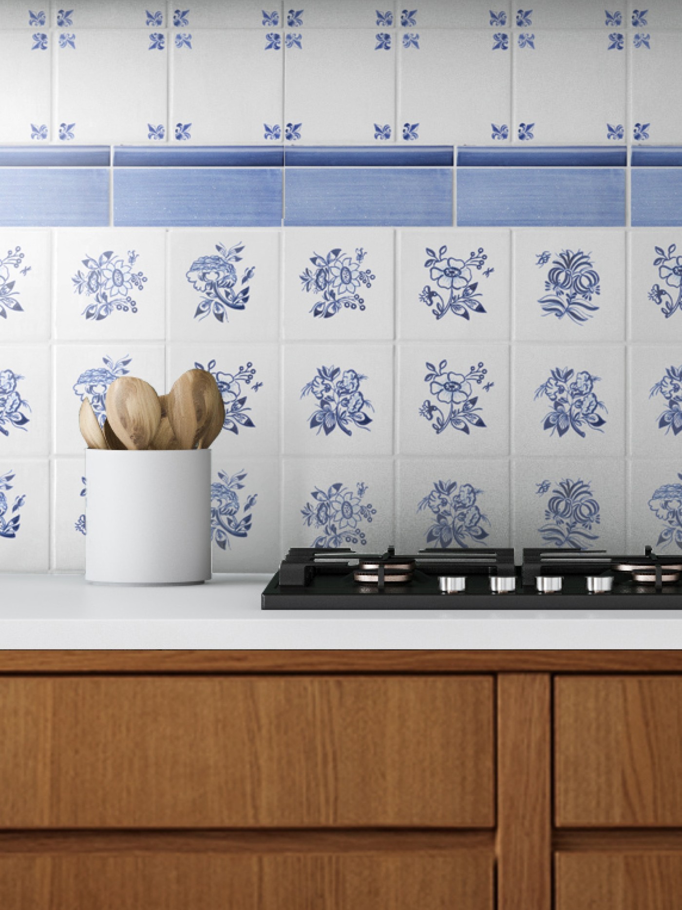 a blue and white tiled stove backsplash in a kitchen with wooden cabinets.