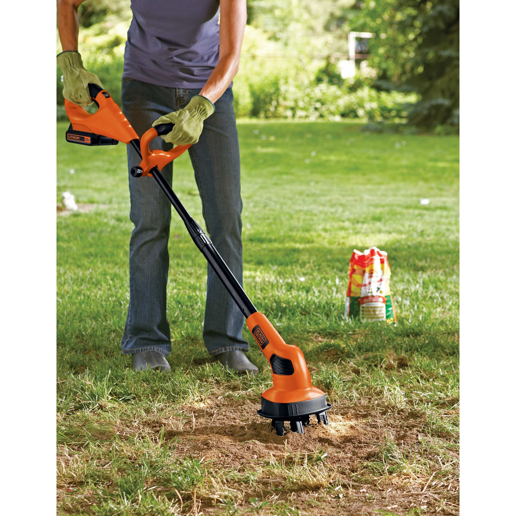 20 volt max lithium garden cultivator being used by person outdoors