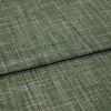 Green crosshatched woven fabric, folded in overlapping layers, displaying textured beige and olive threads; tightly lit close-up emphasizing the weave and subtle sheen on a neutral surface.