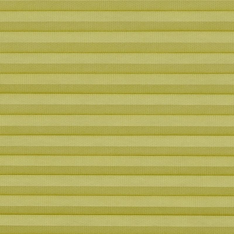 Pale yellow cellular (honeycomb) pleated blind, mounted and fully closed with evenly spaced horizontal cells; filtering and diffusing light, covering a window in an interior with soft, even lighting.