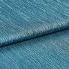 Teal ribbed fabric (folded), showing horizontal raised ridges and woven sheen; folded layers lie against each other in a close-up studio shot with even lighting, emphasizing texture and subtle metallic shimmer.