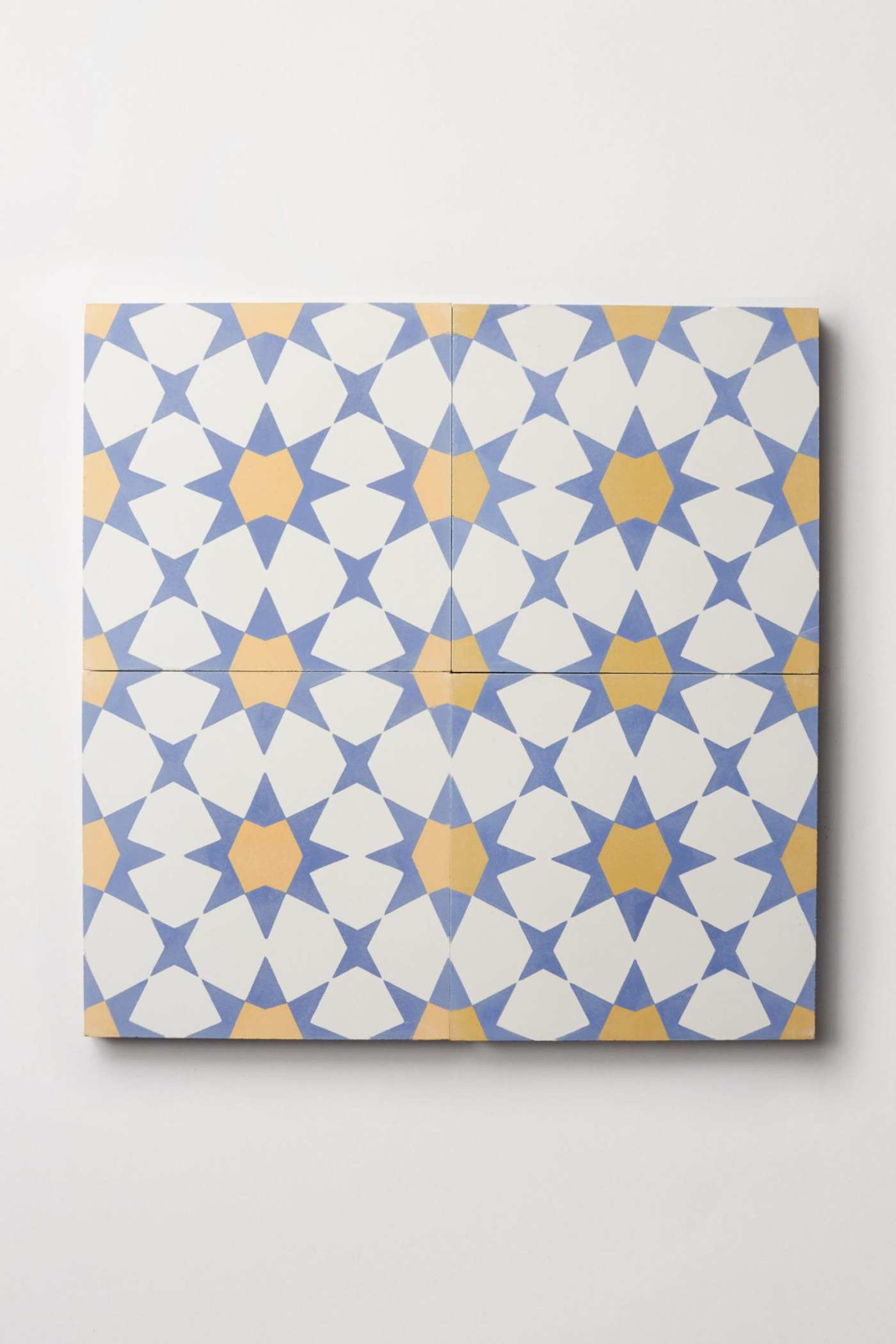 a set of blue and yellow tiles on a white background.