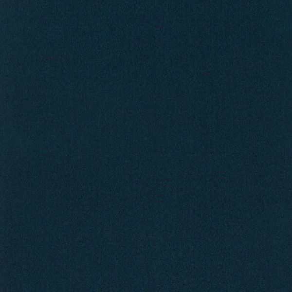 Dark teal, finely speckled surface fills the frame, uniformly lit and featureless, resembling low-light digital noise or coarse fabric.