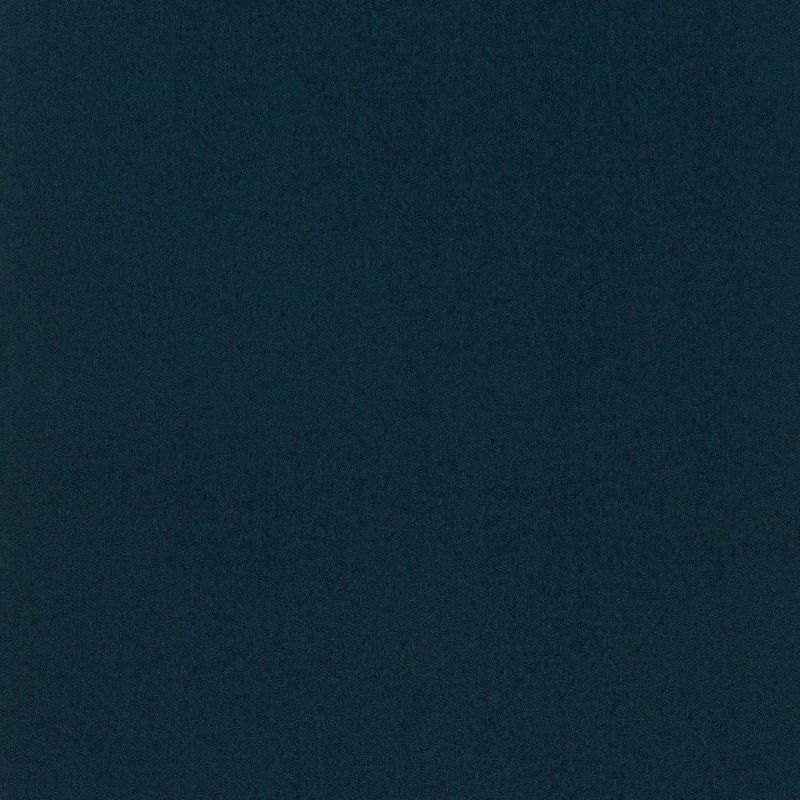 Dark teal, finely speckled surface fills the frame, uniformly lit and featureless, resembling low-light digital noise or coarse fabric.