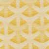 Woven upholstery fabric swatch, photographed flat: textured cream and mustard-yellow yarns forming repeating Y-shaped geometric motifs; close-up macro view, evenly lit with no surrounding room context.