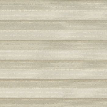Honeycomb cellular shade, fully lowered with wide textured beige horizontal pleats; closed, softly diffusing warm daylight into a neutral interior and obscuring any exterior view.