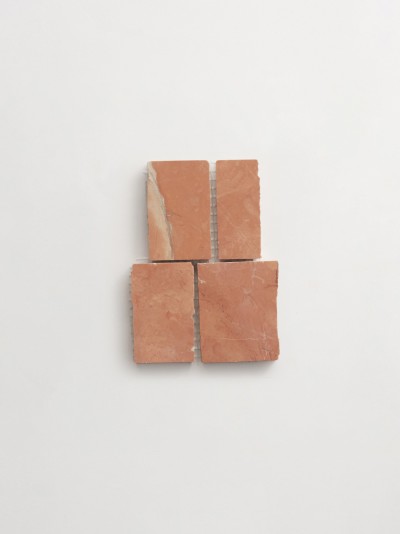 a set of four bricks on a white surface.