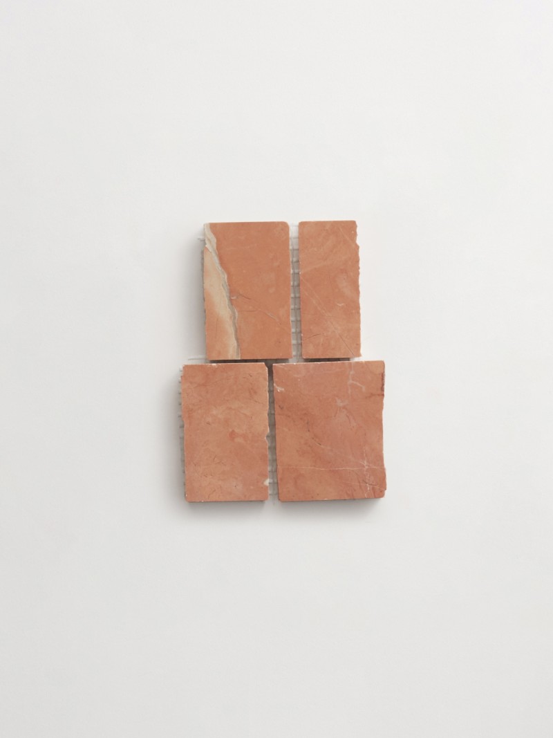 a set of four bricks on a white surface.