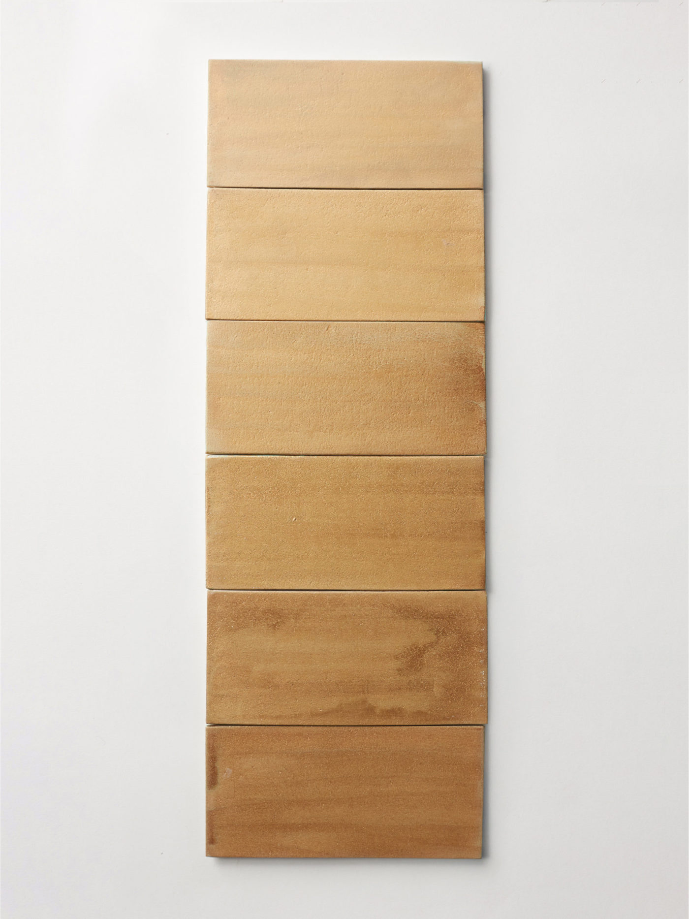 an image of a wooden panel on a white wall.