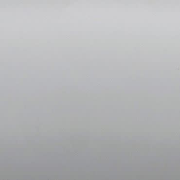 Blank light-gray painted wall with subtle texture; filling the frame, evenly lit; minimal interior surface with soft diffuse light and no visible fixtures, windows, or objects.