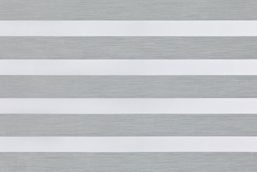 A dual-layer zebra roller blind with alternating opaque white and sheer gray textured horizontal bands across the window; filtering and diffusing daylight while partially blocking view; neutral indoor lighting.
