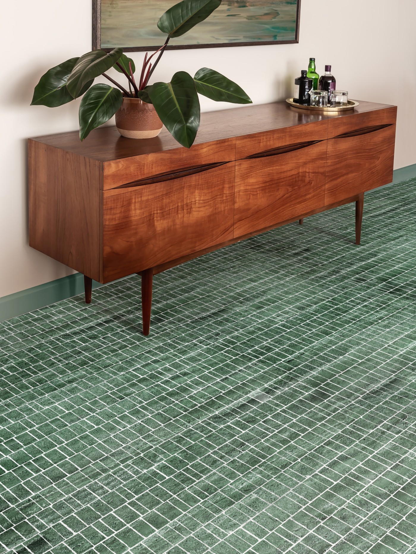 a living room with a green tile floor.