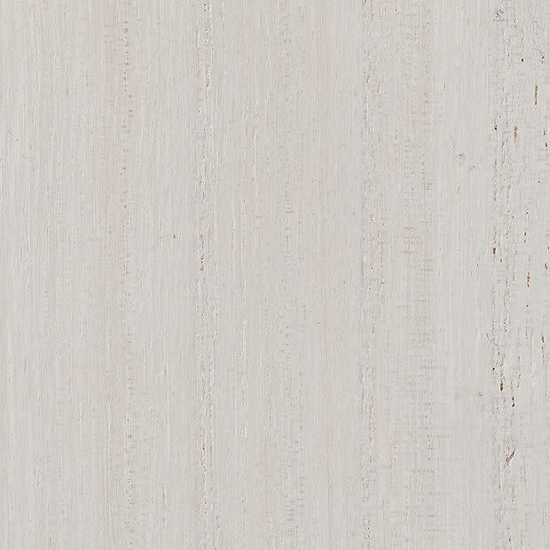 Pale painted wooden panel with vertical grain and subtle weathered streaks; surface lies flat, displaying lightly distressed texture in a neutral, evenly lit background.