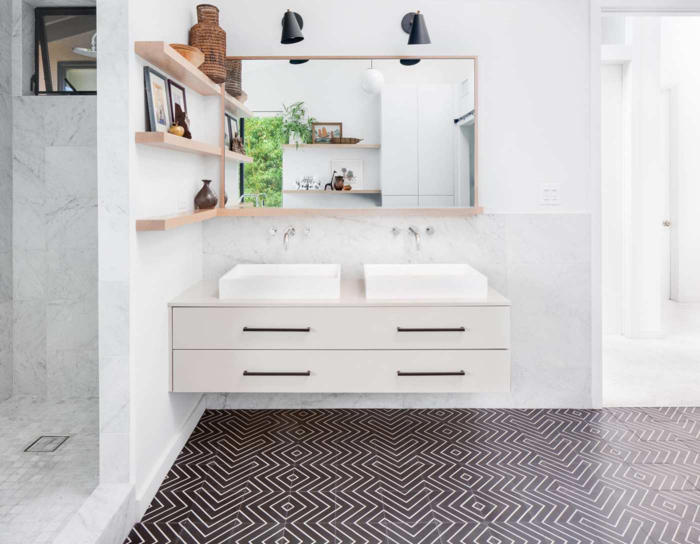 a bathroom with a black and white tile floor.