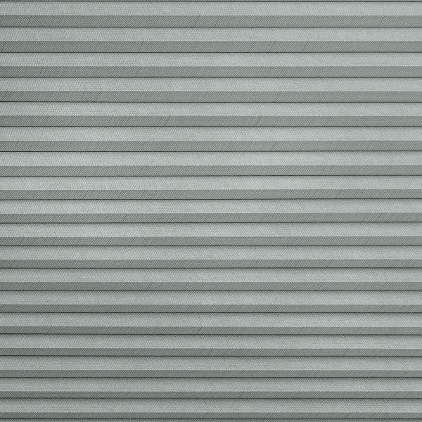 Gray horizontal pleated fabric blinds with subtle herringbone texture; fully closed, filtering soft light; fills the frame, neutral indoor lighting, no surrounding room details visible.