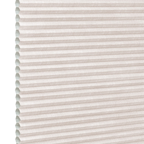 Beige pleated cellular (honeycomb) shade, horizontal ridges with visible open cells at left edge; fully lowered and closed, softly diffusing daylight in a neutral, featureless interior close-up.