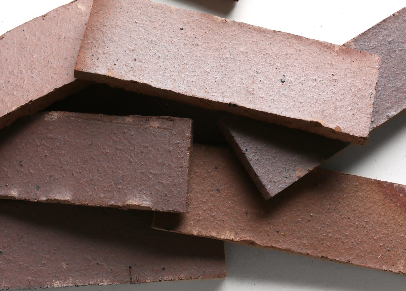 a pile of bricks on a white surface.