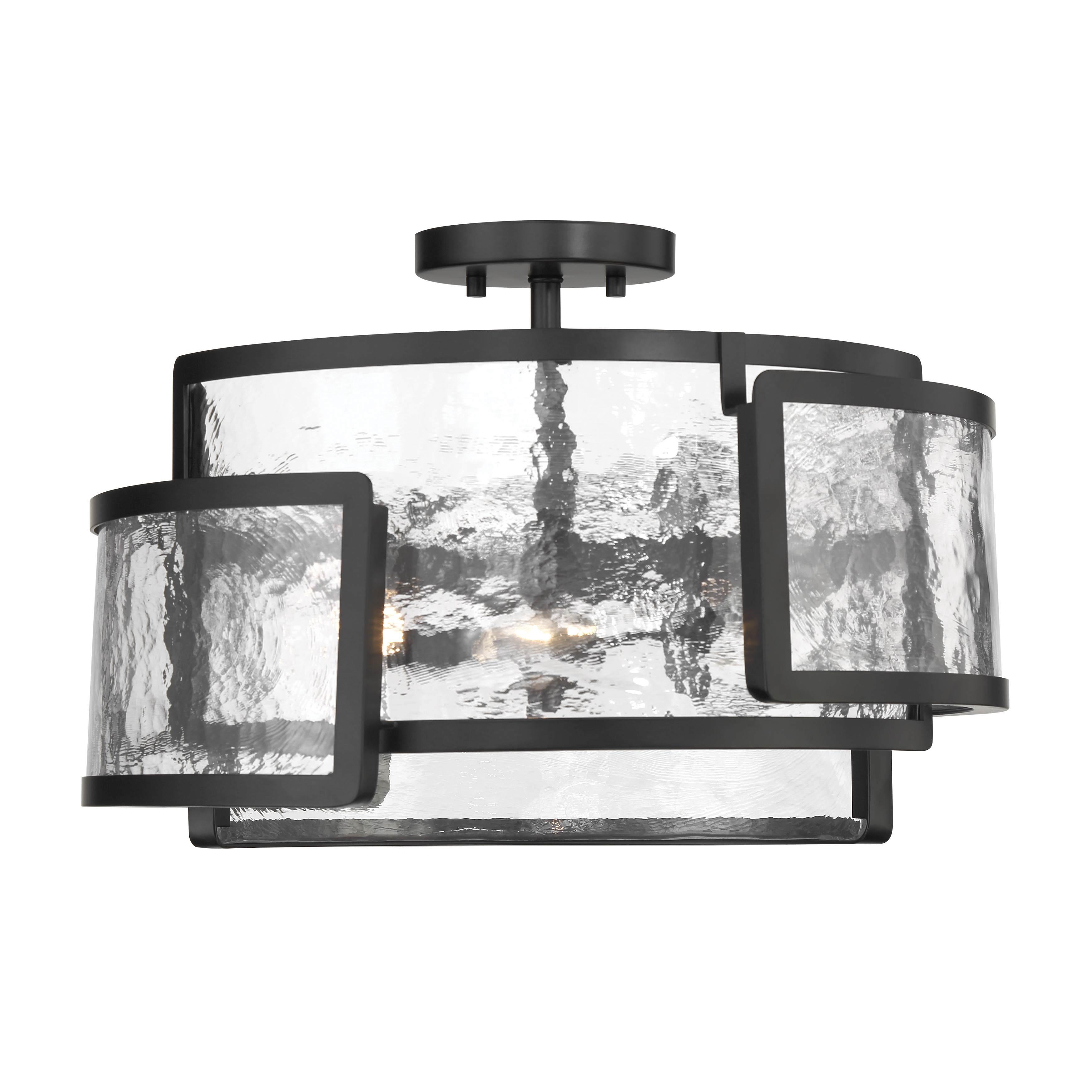 The Bella Collina brings contemporary sophistication with its coal black steel frame and distinctive rock-pressed glass shades. Perfect for spaces with lower ceilings, this 3-light fixture delivers ample illumination while making a bold design statement. - alternate view